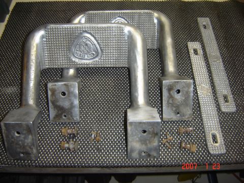 1993 Ford Bronco - Aluminum running boards and hardware shown laid out on a textured mat.