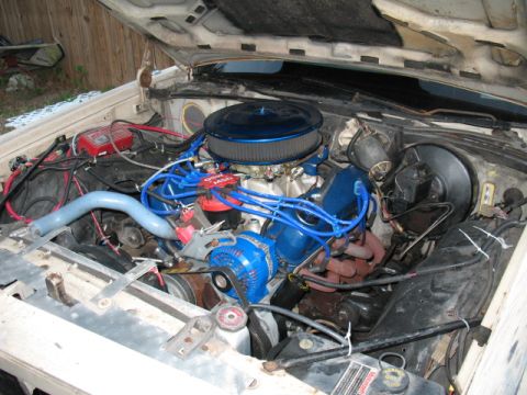 1985 Ford Crown Victoria LTD - Engine bay of a car, showing various components and modifications.