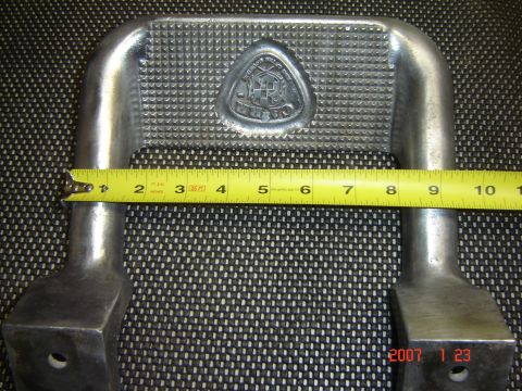 1993 Ford Bronco - A side step part is shown with a ruler for scale, measuring approximately 10 inches.
