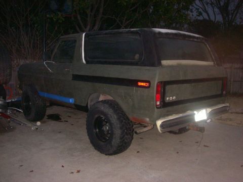 1978 Ford Bronco - This 1978 Ford Bronco features a matte green exterior with black accents and a removable black soft top.