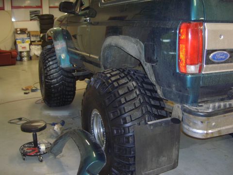 1996 Ford Bronco - This 1996 Ford Bronco is being fitted with large off-road tires and has had its fender removed.