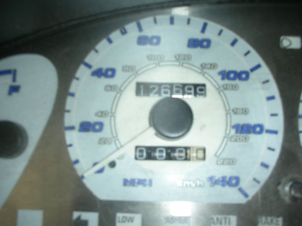 car dashboard with odometer showing 126699 and trip meter showing 0.8.8.0