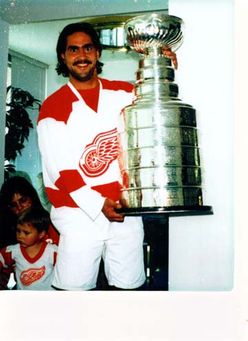 1971 Ford Ranchero - A man celebrates with the Stanley Cup trophy, accompanied by his family.
