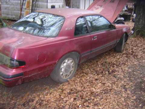 1987 Ford Thunderbird - This 1987 Ford Thunderbird coupe is seen outdoors with its hood open.