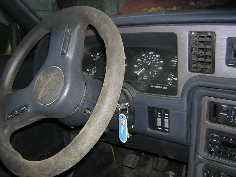 1987 Ford Thunderbird - The interior of a 1987 Ford Thunderbird, its dashboard and steering wheel, is visible in this registry photo.