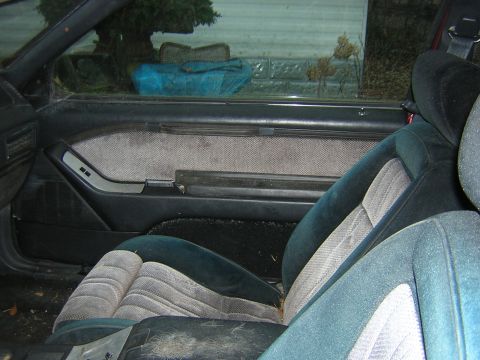 1987 Ford Thunderbird - Interior of a 1987 Ford Thunderbird, showing the driver's seat and door panel.