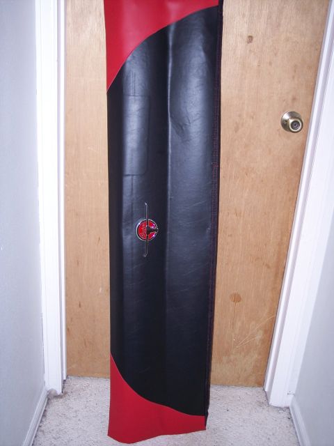 1972 Ford Ranchero - A black and red car floor mat with a circular emblem is shown against a wooden door.