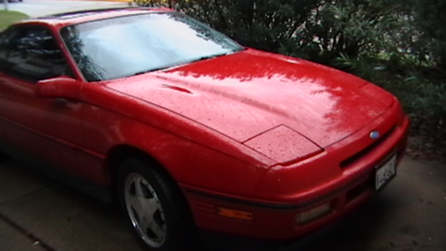 Red 1989 Ford Probe with pop-up headlights