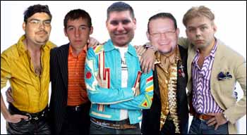 1985 Ford Crown Victoria LTD - A group of five men, dressed in distinct and vibrant clothing, stand together for a photograph.