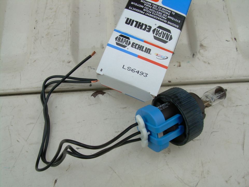NAPA Echlin headlight bulb and socket assembly with wires, box shows LS6493