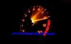 1988 Mazda MX-6 - A close-up of a car's tachometer shows a glowing redline and the word 'MOTOR' illuminated below.