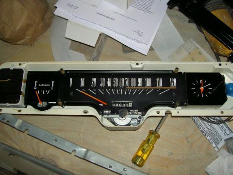 1967 Ford Ranchero - Close-up of a vehicle's dashboard instrument cluster, showing gauges and a clock.