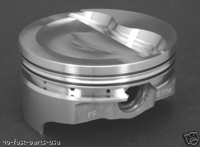 1991 Ford Bronco - Close-up of a single engine piston, showing its machined details and part numbers.
