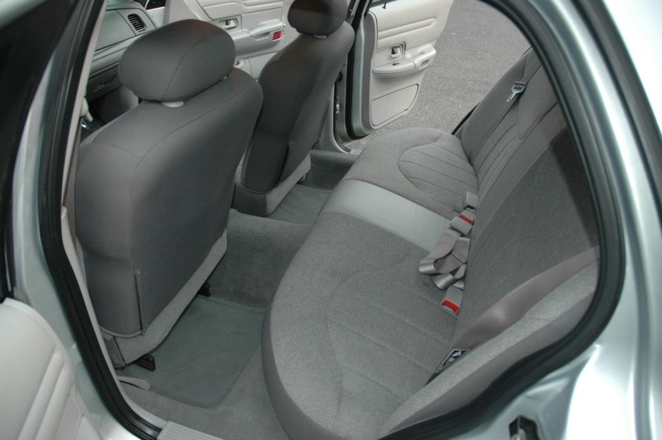 Gray interior rear seats of a 2003 Ford Crown Victoria