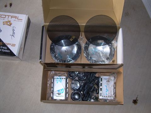 1996 Ford Probe - Unboxed car audio components including speakers, crossovers, and wiring for installation.