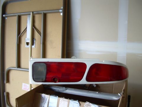 1996 Ford Probe - A white and red car taillight assembly is shown, likely for a rear vehicle light.
