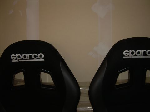 1996 Ford Probe - Two black Sparco racing seats are shown, each with a white logo embroidered on the headrest.