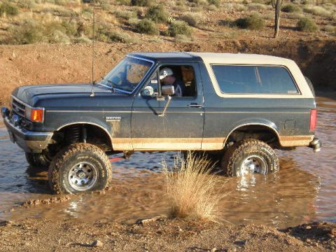 1991 Ford Bronco - This 1991 Ford Bronco is navigating through a muddy water obstacle.