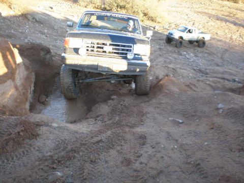 1991 Ford Bronco - This 1991 Ford Bronco is tackling a challenging muddy off-road course.