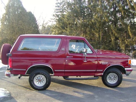 1991 Ford Bronco - This 1991 Ford Bronco is shown from the side, its iconic body style and a spare tire mounted on the back.