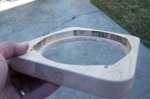 1990 Ford Bronco - A custom wooden speaker adapter is shown, held by a person's hand outdoors.