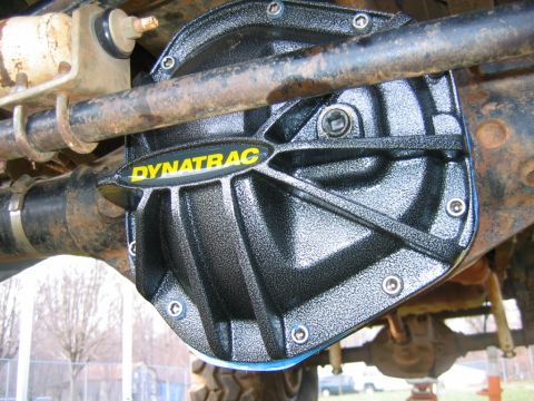 1992 Ford Mustang - Close-up view of a black Dynatrac differential cover installed on a vehicle's axle.
