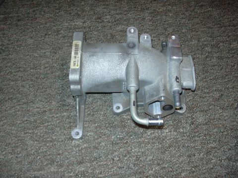 1996 Ford Crown Victoria - An aluminum intake manifold is shown, with a label indicating its part number.