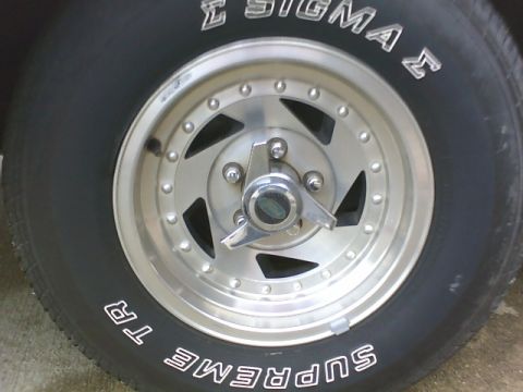 1979 Ford Ranchero - A close-up view of a vehicle's wheel and tire, showing custom rims and tire branding.