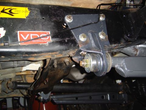 1986 Ford Bronco - This image shows a close-up of a vehicle's suspension system, a custom bracket and a VDO Instruments sticker.