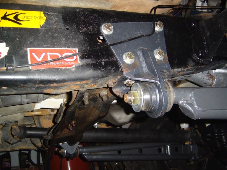 Underside frame bracket with bolts and mount, VDO and KC stickers on frame