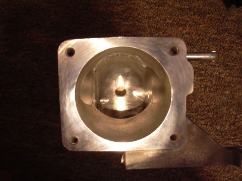 1996 Ford Crown Victoria - Close-up of a throttle body part, showing its internal structure and mounting points.