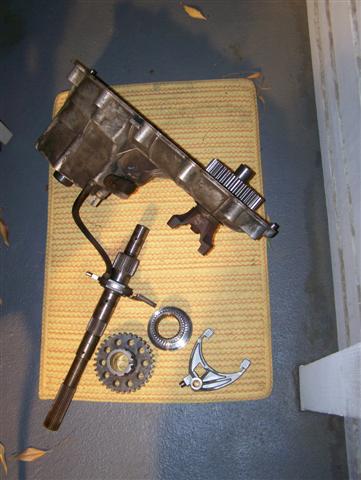 1995 Ford Bronco - Disassembled transmission components are shown on a mat, with a Supermotors.net logo in the corner.
