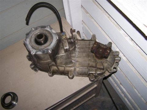 1995 Ford Bronco - Transfer case assembly, likely for a 4x4 vehicle, shown with attached components.