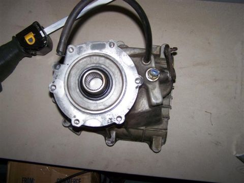 1995 Ford Bronco - Differential housing with hoses and a tool nearby.