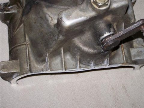 1995 Ford Bronco - This is a close-up view of a used transmission case, showing signs of wear and grime.