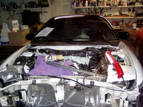 1993 Ford Probe - Engine bay of a 1993 Ford Probe with front-end components removed for a ZE swap.