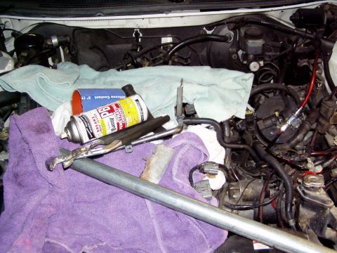 1993 Ford Probe - Engine bay during a ZE swap, with tools and cleaning supplies laid out.