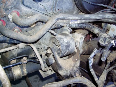 1993 Ford Probe - Close-up view of an engine mount and associated hoses and wiring.
