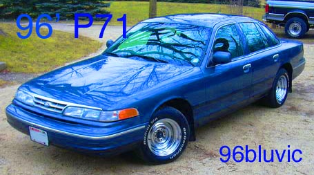1996 Ford Crown Victoria - Blue 1996 Ford Crown Victoria sedan is shown from a 3/4 front angle with aftermarket wheels.