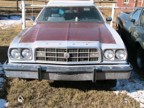 1973 Ford Ranchero - This Ford Ranchero has a distinctive grille and dual headlights, with a contrasting maroon hood.