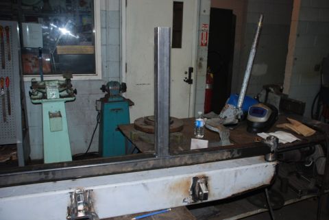 1996 Ford Bronco - A metal fabrication project is underway in a workshop setting, with various tools and equipment visible.