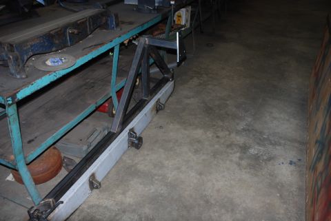 1996 Ford Bronco - A custom rear bumper is being fabricated, with metal framing attached to a grey bumper section on a workbench.