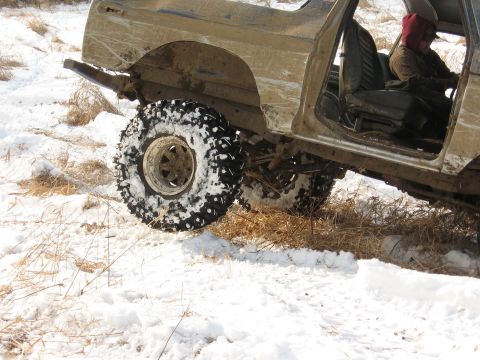 1979 Ford Bronco - This heavily modified 1978 Ford Bronco is shown in a snowy, off-road environment.