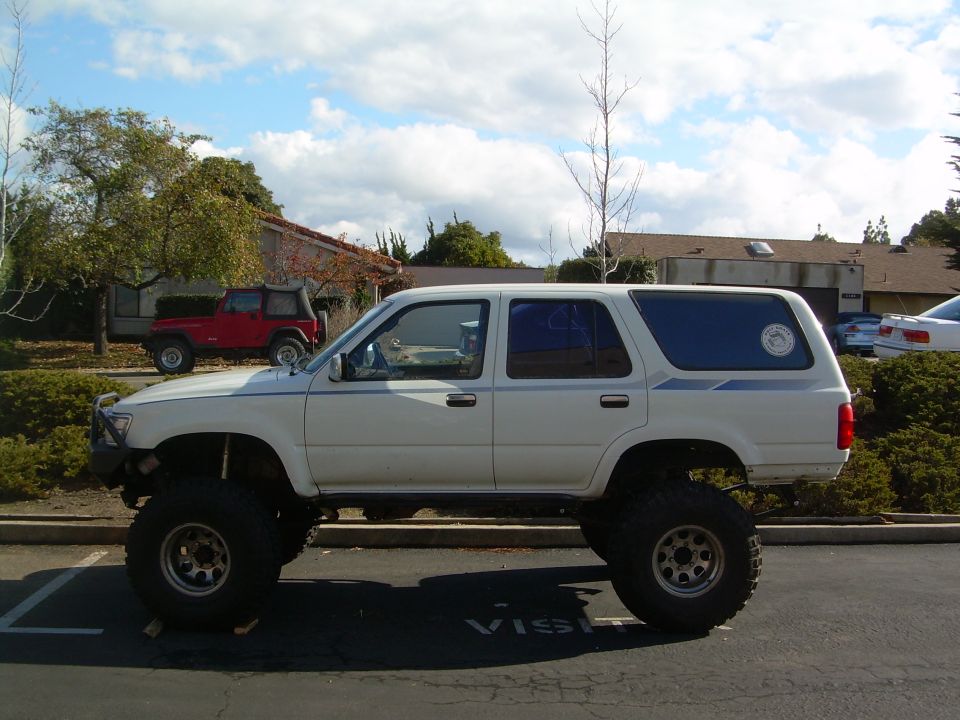 White lifted 1993 Toyota 4Runner side view with large tires