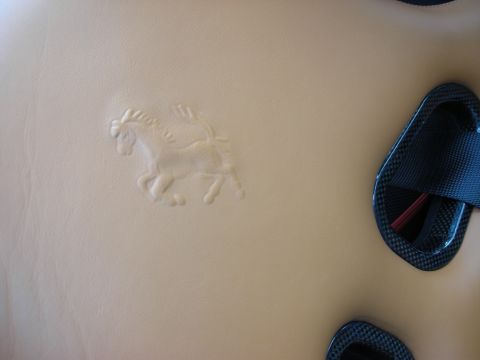 1998 Ford Crown Victoria - Tan leather upholstery embossed with the Ferrari prancing-horse logo next to carbon-fiber harness slots.