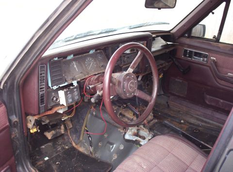 1987 Jeep Cherokee - Interior view of a 1987 Jeep Cherokee, showing the dashboard and driver's seat.