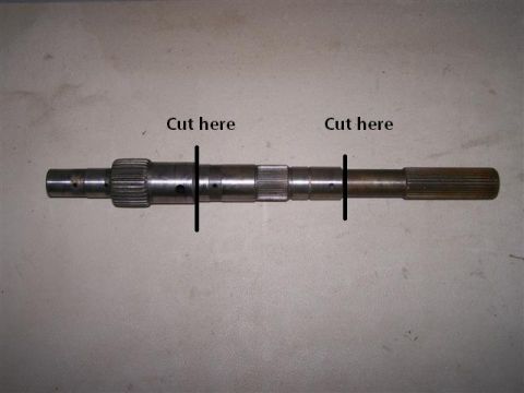 1995 Ford Bronco - A metal shaft is shown with two marked sections labeled 'Cut here', indicating modification points.