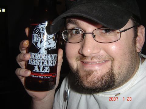 1993 Ford Bronco - Man holding a bottle of Arrogant Bastard Ale, with a date stamp of 2007-01-28.