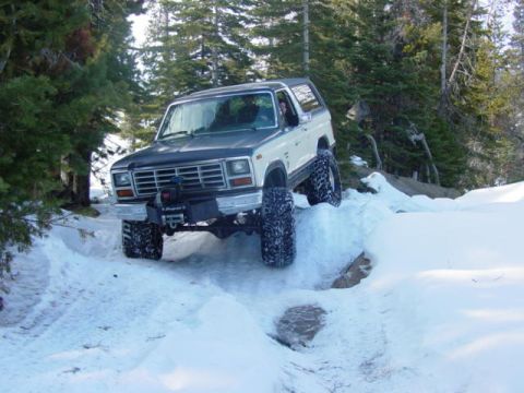 1986 Ford Bronco - This 1986 Ford Bronco navigates a challenging snowy terrain.