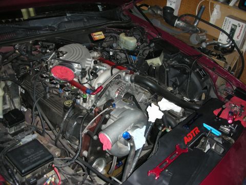 1992 Ford Crown Victoria - Custom engine modifications underway, with tools ready for installation.